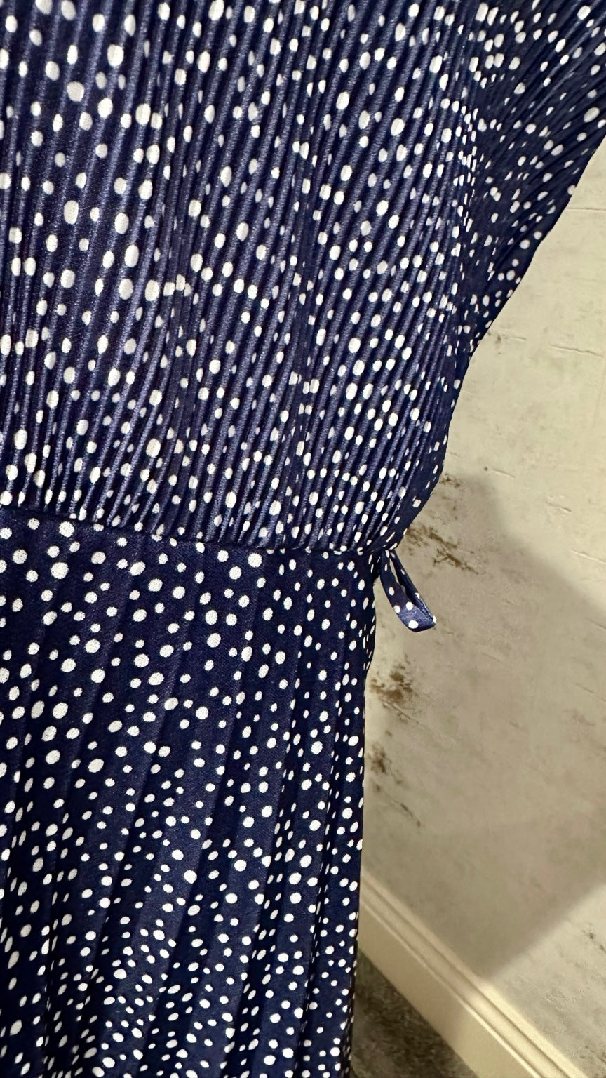 Waist seam and pleating detail