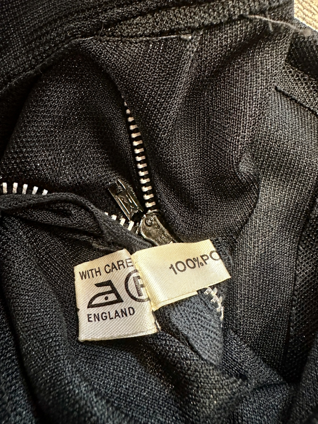 B56 care and made in England label — fingers removed